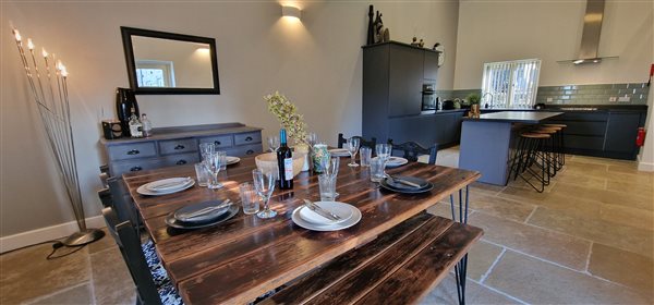 dining area with the open plan kitchen behind